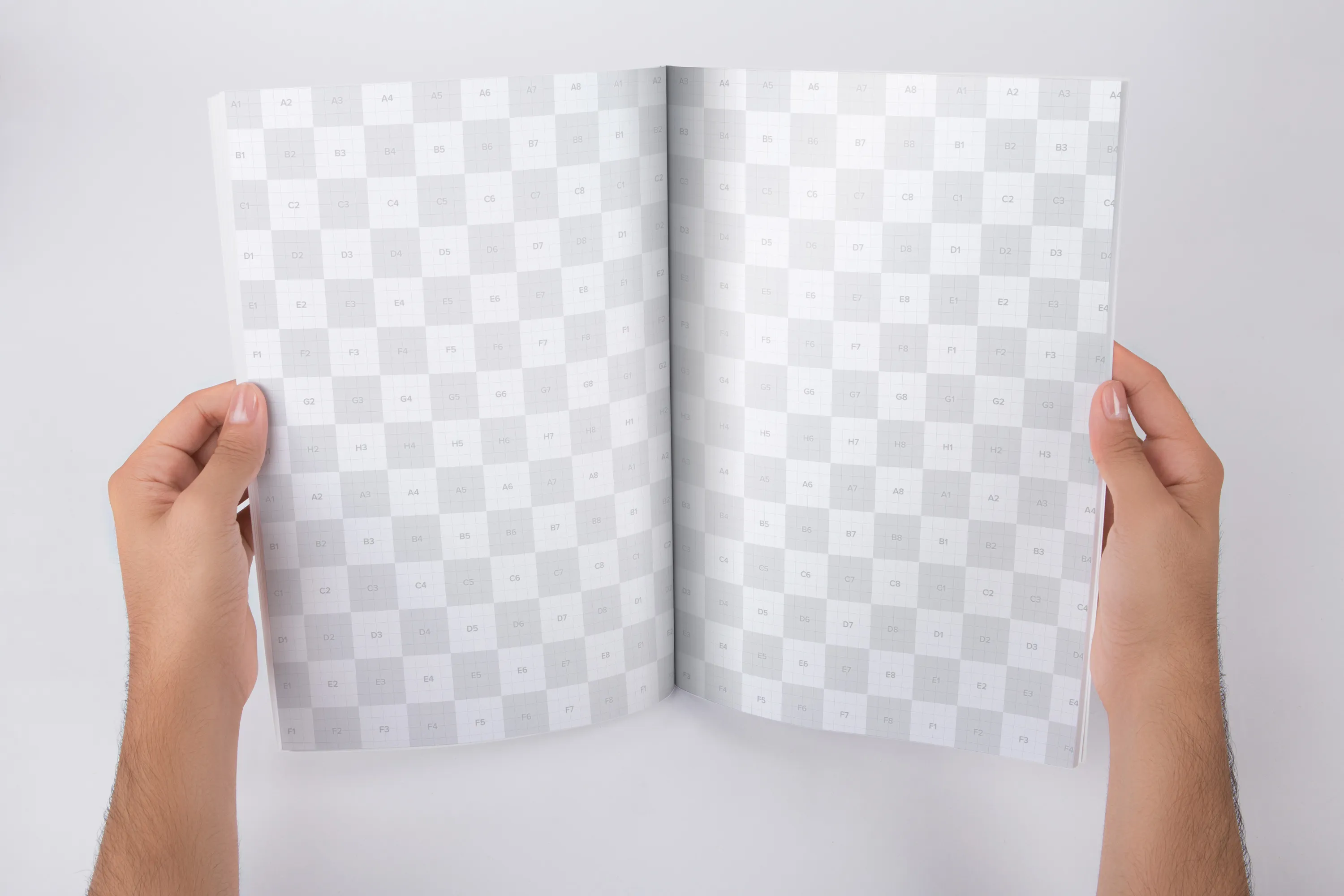 手持A4大小杂志内页版式设计打开效果图样机 Holding A4 Magazine Opened Mockup插图(2)